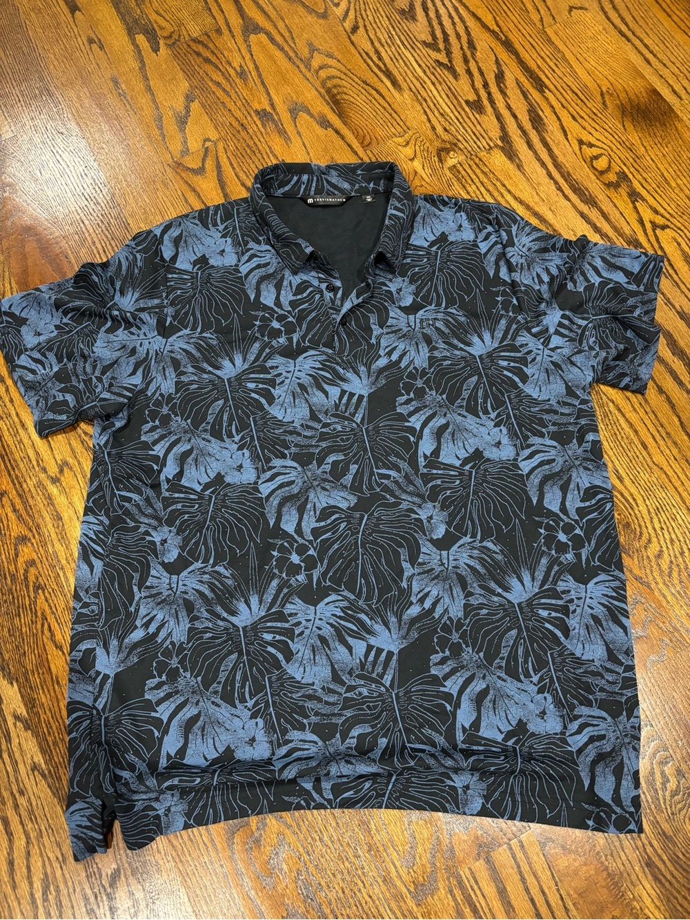 TravisMathew Black Polo with Blue Leaf Print